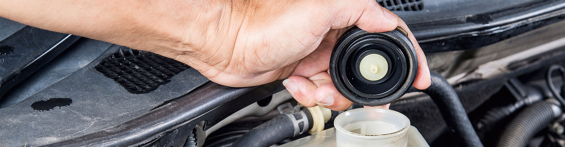 a person holding a cell phone in their hand  serviced by Brake Pros of Waltham in Chelmsford specializing in Waltham brake services.