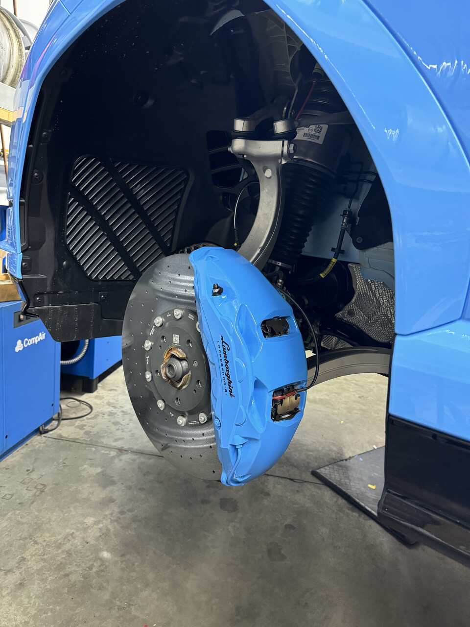 a blue and black tire brake serviced by Brake Pros of Waltham in Billerica specializing in brake fluid change.