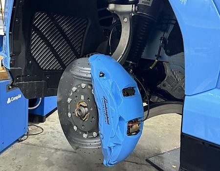 a blue and black tire brake serviced by Brake Pros of Waltham in Billerica specializing in brake fluid change.