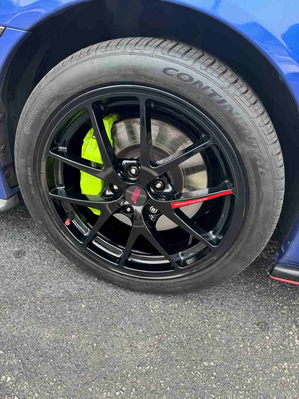 a small car with a large tire on it  serviced by Brake Pros of Waltham in Cambridge specializing in ASE-certified technicians.