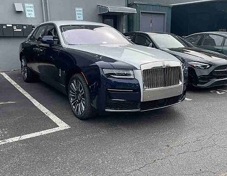 a car parked in a parking lot with a lot of other cars  serviced by Brake Pros of Waltham in Everett specializing in German car brake specialist.